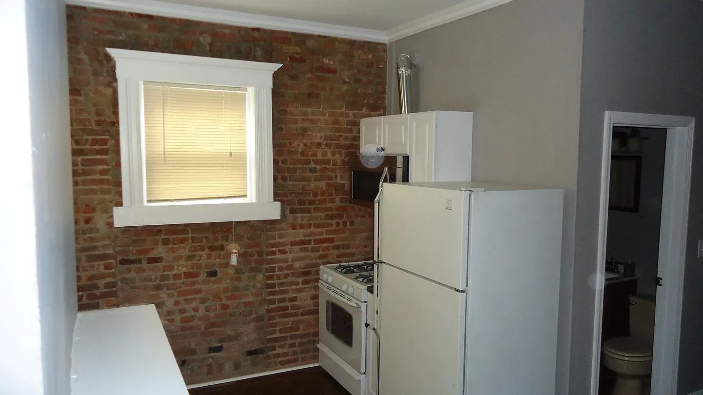 A kitchen mid-renovation, cabinets and flooring installed
